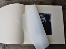 Carica l'immagine nel visualizzatore di Gallery, opened photo album with white pages and protective tissue