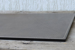 particular of stylish seams on a leather desk pad by Giovelli Design