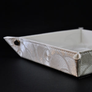stylish finishes and classy metal studs on a white catchall by Giovelli Design