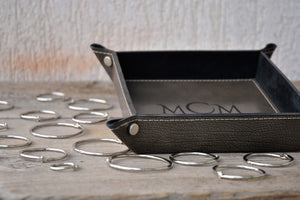 stunning finishes and non openable metal studs of a gray leather monogrammed catchall by Giovelli Design