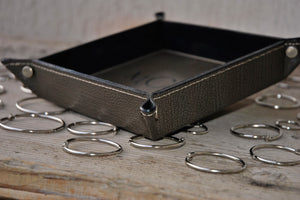 fancy seams and finishes of a gray leather catchall tray by Giovelli Design