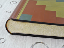 Load image into Gallery viewer, stylish finishes on a mosaic leather album by Giovelli Design
