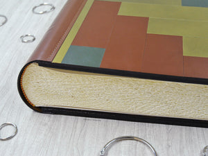 stylish finishes on a mosaic leather album by Giovelli Design