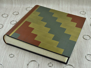 picture from above of a classy photo album by Giovelli Design