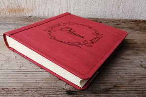 red faux leather album with white pages by Giovelli Design