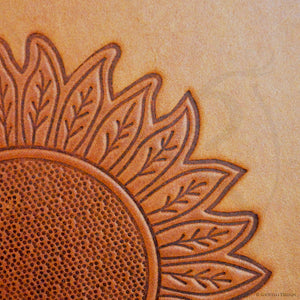 part of debossed sunflower on a photo album by Giovelli Design