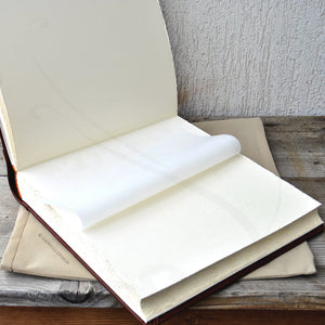 opened photo book with white pages by Giovelli Design