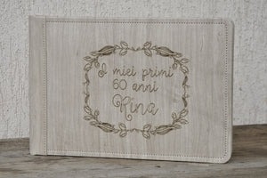 personalization on a beige faux leather album with a wood pattern by Giovelli Design