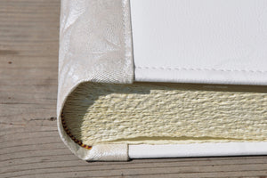 particular of classy finishes and seas on a photo album with white pages by Giovelli Design